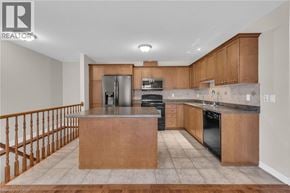 Smithville apartment for rent - A modern kitchen with wooden cabinets and a central island.