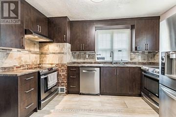 Cambridge apartment for rent - A kitchen with brown cabinets and a brick wall.