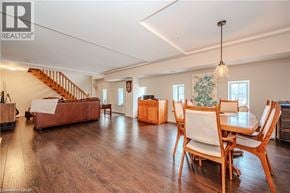 Waterloo condo for rent - A living room with a couch, chairs, and a dining table.