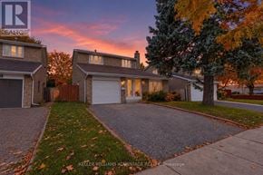 Toronto (Steeles) apartment for rent - A house with a driveway in front of it.