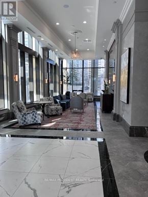 Mississauga (Fairview) condo for rent - A spacious lobby with a marble floor and a large window.