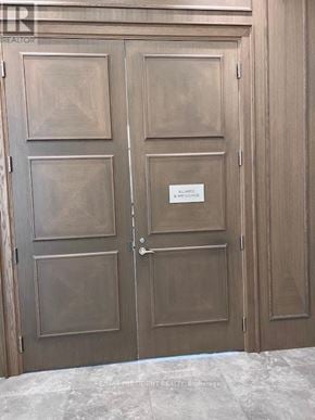 Mississauga (Fairview) condo for rent - A pair of double doors with a sign on the right door.