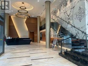Toronto (Bayview Village) condo for rent - A modern kitchen with a dishwasher and a microwave above the counter.