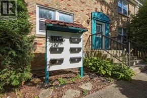 London South (South F) multi-family for rent - A sign with the word REALTOR on it is in front of a brick house.