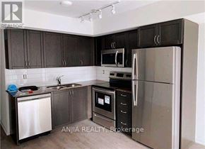 Toronto (Bendale) condo for rent - A kitchen with dark brown cabinets and stainless steel appliances.