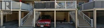 Pickering (Town Centre) townhouse for rent - A red car is parked in a garage.