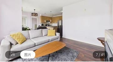 Surrey apartment for rent - A living room with a grey sofa and a wooden coffee table.