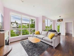Surrey apartment for rent - A living room with a grey couch and a coffee table.
