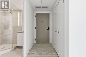 Toronto (Thorncliffe Park) condo for rent - A white hallway with a door and a window.