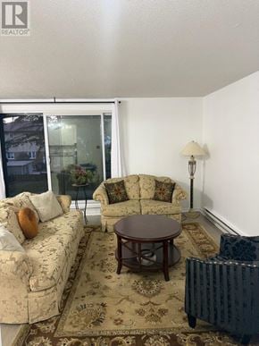 Toronto (Hillcrest Village) townhouse for rent - A living room with a couch, chair, and lamp.