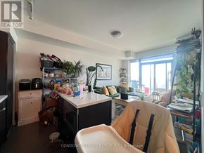 Toronto (Casa Loma) condo for rent - A kitchen with a white counter and a white chair.