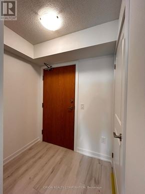 Pickering (Bay Ridges) condo for rent - A room with a wooden door and white walls.