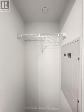Pickering (Bay Ridges) condo for rent - A white closet with a shelf and a door.