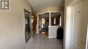 Brampton (Bram East) apartment for rent - A hallway with a realtor logo on the wall.