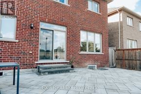 Brampton (Northwest Brampton) apartment for rent - A red brick house with a glass door and windows.