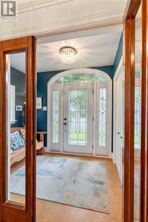St. John's apartment for rent - A foyer with a glass door and a rug on the floor.