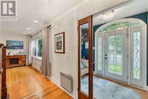St. John's apartment for rent - A hallway with a blue rug and a glass door.