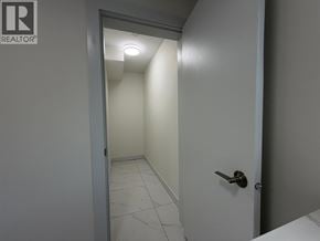 Vancouver apartment for rent - A hallway with a door on the right and a wall on the left.