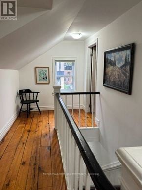 Selwyn apartment for rent - A room with a wooden floor and a chair.
