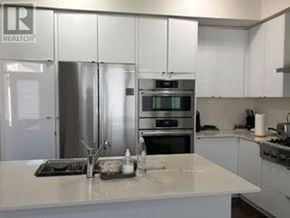 Milton (Walker) apartment for rent - A kitchen with a white counter top and stainless steel appliances.