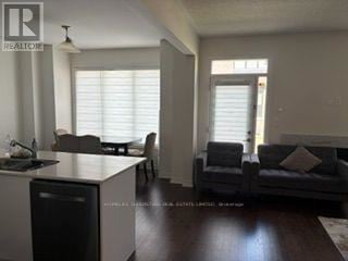 Milton (Walker) apartment for rent - A living room with a grey couch and a wooden table.