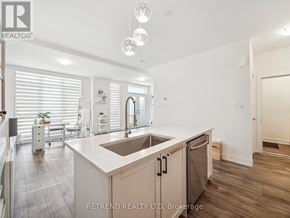 Richmond Hill (Oak Ridges) townhouse for rent - A modern kitchen with a sink and a dishwasher.