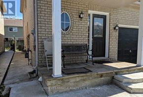 Brampton (Fletcher's Meadow) apartment for rent - A house with a porch and a sign that says "REALTOR".