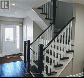 Brampton (Fletcher's Meadow) apartment for rent - A staircase with black and white railings and steps.
