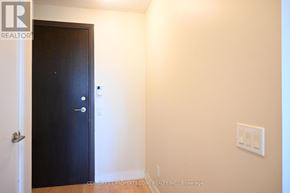 Toronto (Islington-City Centre West) condo for rent - A room with a black door and a light switch on the wall.