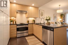 Vancouver apartment for rent - A modern kitchen with wooden cabinets and stainless steel appliances.