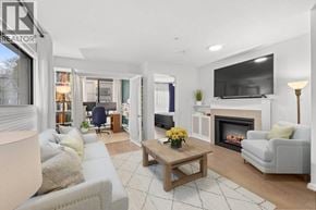 Vancouver apartment for rent - A living room with a fireplace and a television.