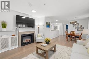 Vancouver apartment for rent - A living room with a fireplace and a television.