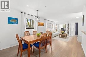 Vancouver apartment for rent - A dining room with a wooden table and chairs.