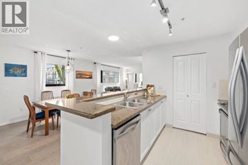 Vancouver apartment for rent - A modern kitchen with a dining table and chairs.