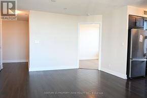 Toronto (Markland Wood) condo for rent - A room with a refrigerator on the right side.