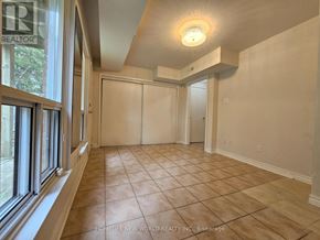 Toronto (Hillcrest Village) townhouse for rent - A room with a tiled floor and a ceiling light fixture.