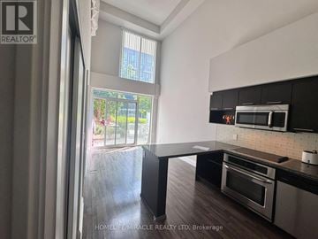 Toronto (Clanton Park) condo for rent - A modern kitchen with a stainless steel oven and microwave.