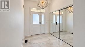 Oshawa (Windfields) apartment for rent - A room with a white door and a glass wall.