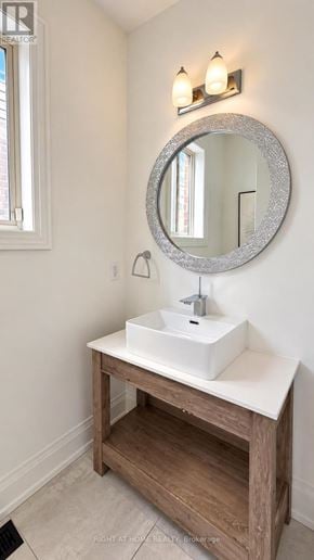 Oshawa (Windfields) apartment for rent - A bathroom with a sink and mirror.