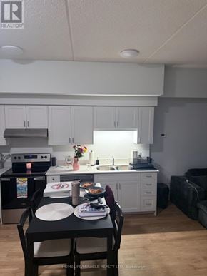 London East (East K) condo for rent - A kitchen with a table and chairs in front of it.