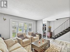 London South (South Y) apartment for rent - A living room with a couch, chairs, and a coffee table.