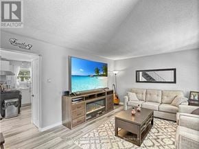 London South (South Y) apartment for rent - A living room with a flat screen TV and a couch.