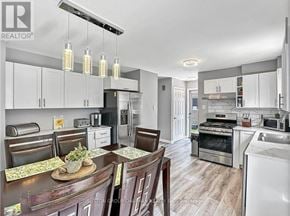 London South (South Y) apartment for rent - A modern kitchen with a dining table set for four.