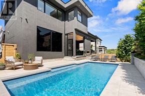 Niagara-On-The-Lake (St. Davids) apartment for rent - A modern house with a pool in the backyard.