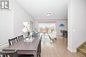 Niagara Falls (Forestview) apartment for rent - A dining room with a wooden table and chairs.