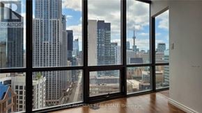 Toronto (Bay Street Corridor) condo for rent - A real estate brokerage office with a view of the city.