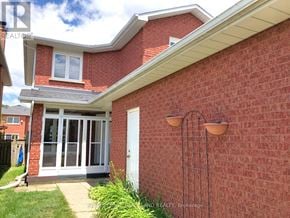 Newmarket (Gorham-College Manor) apartment for rent - A red brick house with a white door and windows.