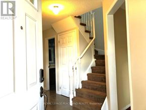 Newmarket (Gorham-College Manor) apartment for rent - A staircase with a white railing and a light on the ceiling.