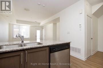 Pickering (Woodlands) townhouse for rent - A kitchen with a sink and a dishwasher.