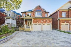 Aurora apartment for rent - A brick house with a garage in front of it.